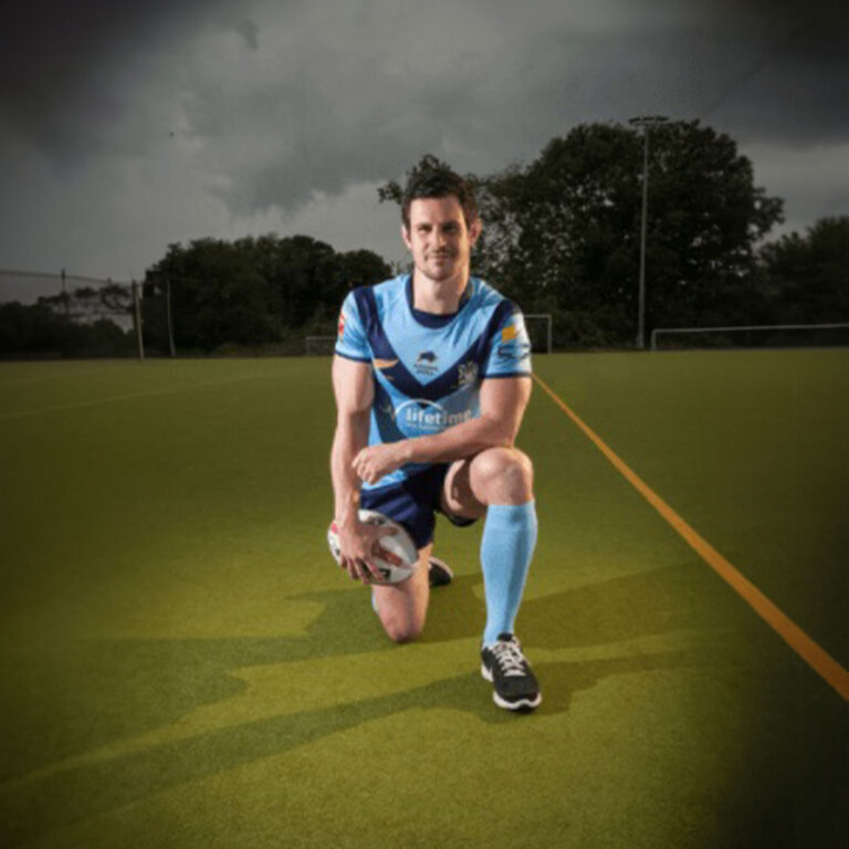 Joe McLean in rugby kit on sports ground