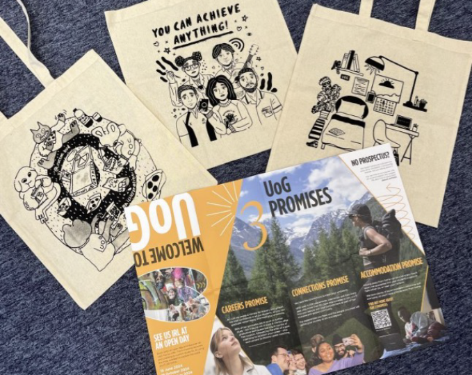 Canvas tote bags with student illustrations on along side a large flyer