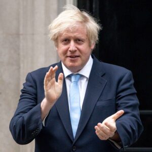 Boris Johnson clapping outside 10 Downing Street.