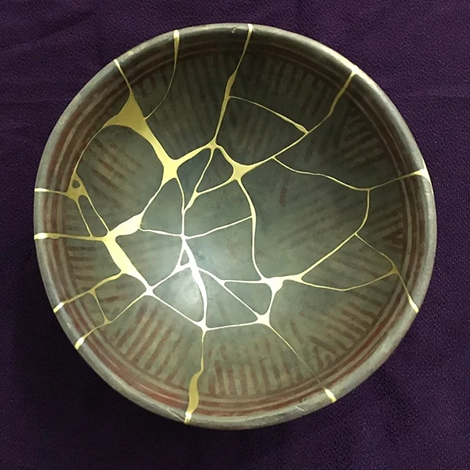 A broken bowl mended with gold