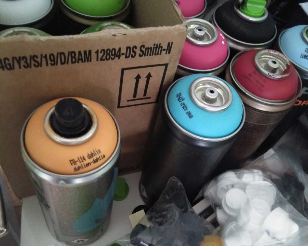 Close up photo of spray cans.