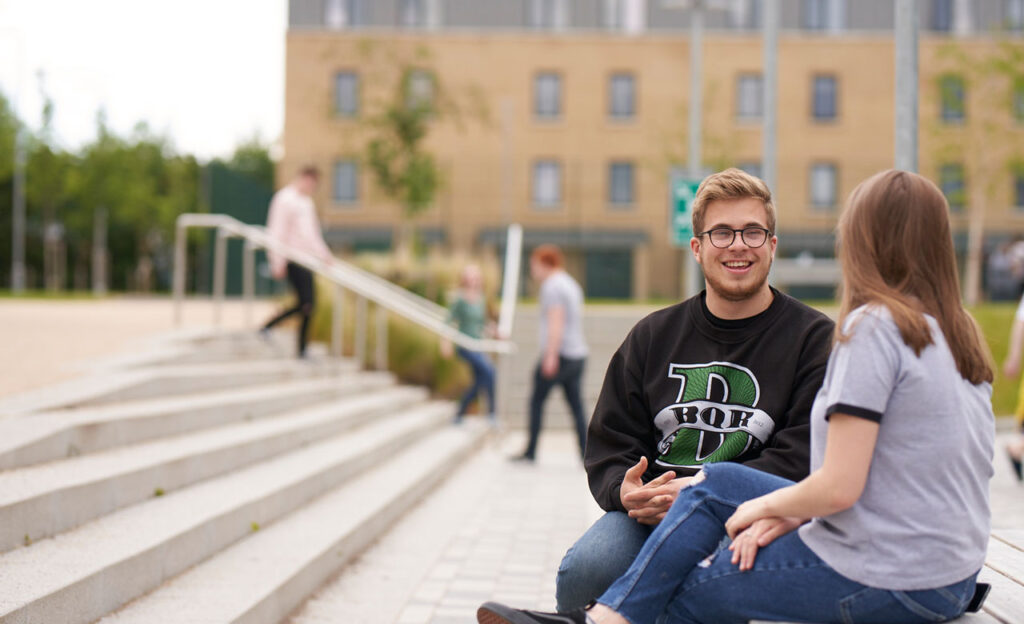 Students talking on Pittville campus