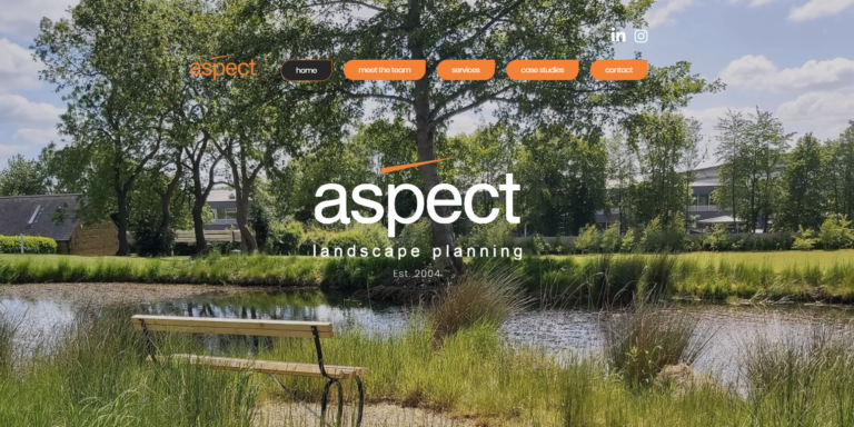 Homepage image of Aspect Landscape Planning featuring a photo of a bench overlook a pond.