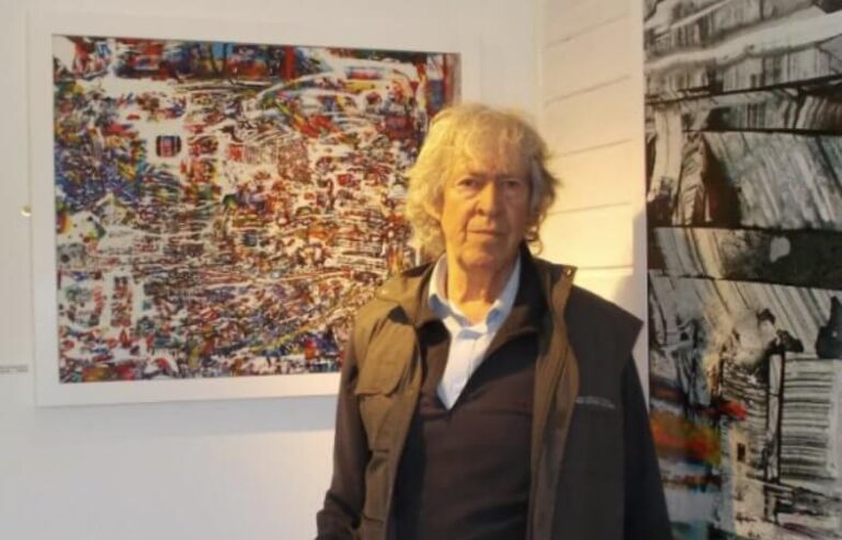 Alan Steeves-Booker in front of his painting